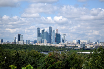 Fototapeta na wymiar Moscow, Russia - July 8, 2019: The view of the Moscow International Business Center skyscrapers and cloudy sky from the Sparrow Hills observation deck