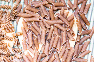 raw penne pasta close up