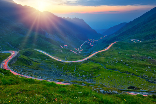 Traffic trails on Transfagarasan pass at sunset. Crossing Carpathian mountains in Romania, Transfagarasan is one of the most spectacular mountain roads in the world