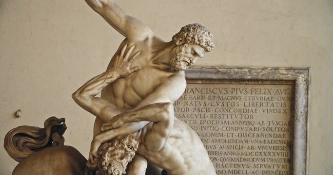 Side view of impressive sculpture statue of Hercules beating the Centaur Nessus. Loggia dei Lanzi, Florence. Famous Greek legend. Mythology.