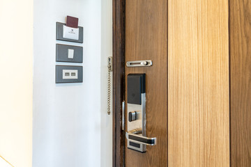 Door security smart lock and room switcher control platform on the wall beside the door in Thailand resort.