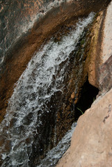 Close up waterfall raining down from above 