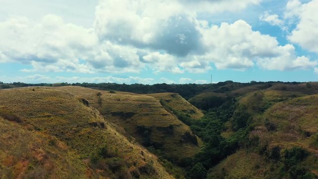 Teletubbies Hill. Revealing Drone Shot Tropical Savanna Valley at Nusa Penida, Bali - Indonesia