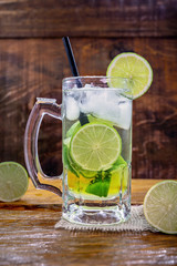 Beer caipirinha. Brazilian exotic drink of beer with lemon and cachaça.