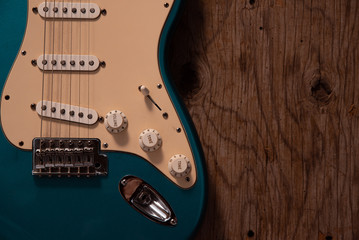 Fototapeta na wymiar Electric guitar on a wooden background.