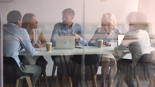 Behind closed doors staff and leader gathered on morning briefing