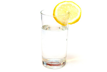 Fototapeta na wymiar Glass of pure water with lemon isolated on a white background