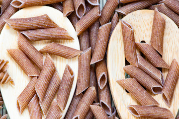 raw penne pasta close up
