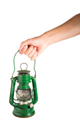 Old green latern in hand isolated on white background