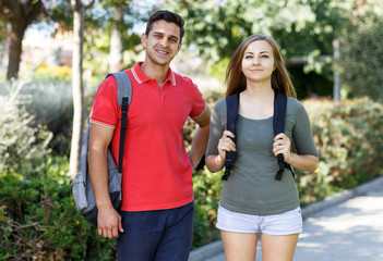 Portrait of happy couple who is walking around park together