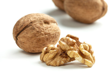 walnuts scattered on a white table