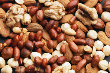 Organic mixed nuts as background, top view