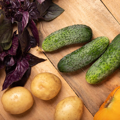 Vegetables on wood, healthy food, herbs and spices.