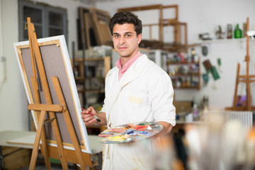 Artist painting on canvas