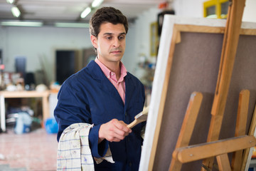 Artist painting on canvas