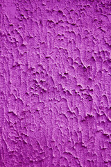 textured background with space for text. Texture rough plaster on the wall of concrete. Purple
