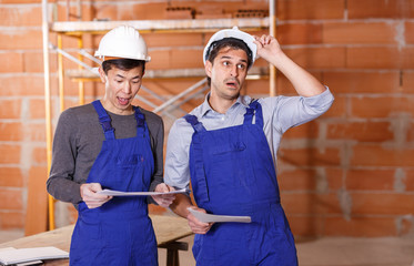 Two shocked professional builders
