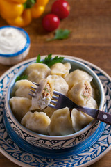 Dumplings stuffed with meat. Pierogi, varenyky, vareniki, pyrohy - dumplings with filling, popular dish in many countries.
