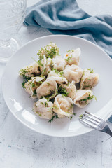Dumplings with greens in a plate