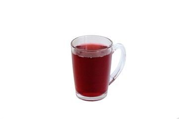 Transparent glass cup with a red fruit drink on a white background.