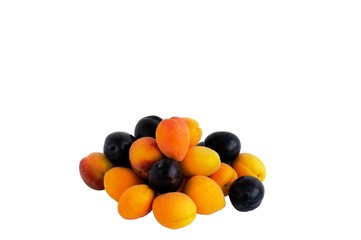 Fruits of apricot, plum and peach on a white background.
