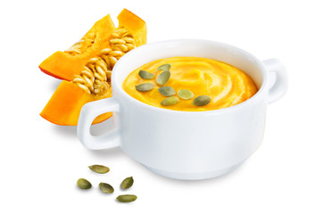 Pumpkin soup in white bowl on a white isolated background