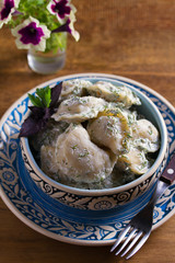 Dumplings stuffed with popato. Pierogi, varenyky, vareniki, pyrohy - dumplings with filling. Healthy vegetarian homemade food