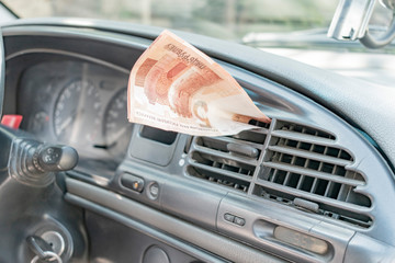 Paper banknote in the car