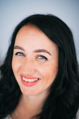 Portrait of brunette girl without retouching, visible skin problems