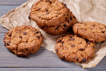 Chocolate oatmeal chip cookies on the rustic wooden table.