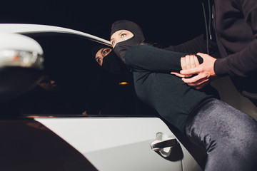 Masked robber woman car robbery found arrest.
