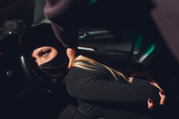 Masked robber woman car robbery found arrest.