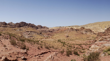 View of rocky hills and mountains in prehistoric rock carved city Petra, UNESCO World Heritage, the capital of the kingdom of the Nabateans in ancient times, Jordan.