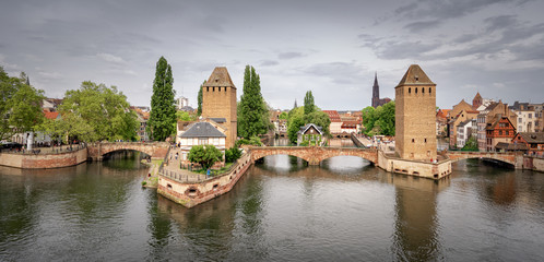The covered bridges of Strasbourg are three bridges spanning l'Ill in the heart of Petite France....