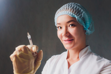 Lip Augmentation. Beautiful Young Woman's Mouth Receiving Hyaluronic Acid Injection. Closeup Of...