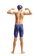 Young male swimmer flexing his muscles