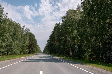 flat asphalt road for cars with markings
