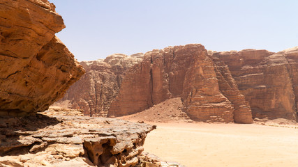 View of rock formations and mountains in the middle of Wadi Rum desert, Jordan.