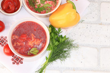 Traditional Russian borsch with egg and bread on a wooden table, place for text and menu, copy space. Delicious traditional natural food and cooking ingredients, healthy diet concept, top view,