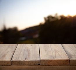 wooden empty table on the background of a blurred forest garden park