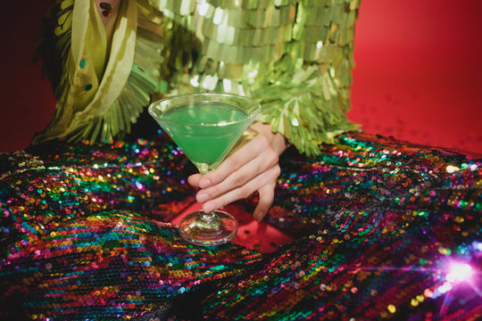 Crop woman with cocktail