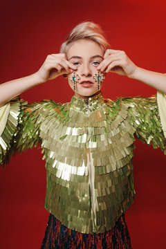 Glam model with cross earring