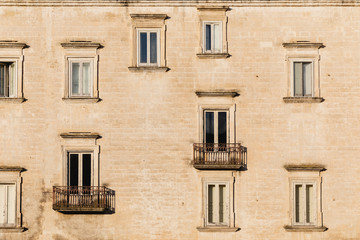 Windows on the facade of an ancient palace