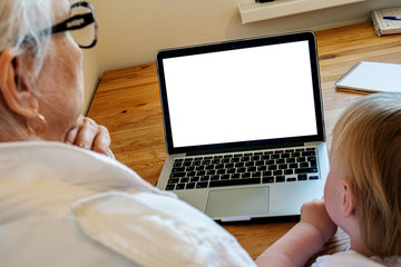 The white screen of the monitor, which look at the grandmother (elderly woman) and grandson (small child of four years). Mockup for your design