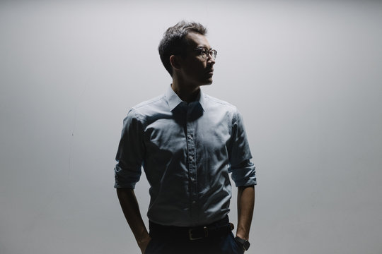 Thoughtful businessman standing indoors