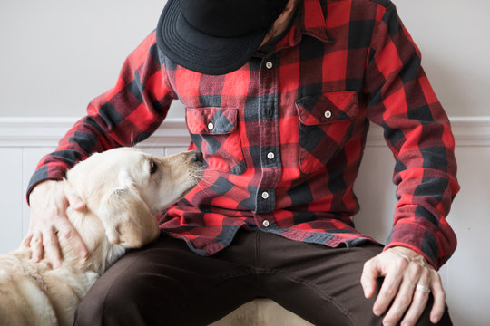 Man petting White Dog