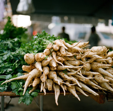 A big bunch of parsnips laying on a table