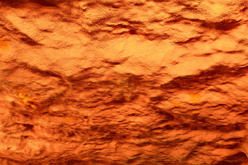 orange painted wall as background texture.Copy space