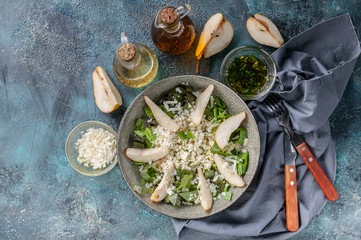 Keto diet. Salad with cottage cheese, Romano leaves, sweet pear and cheese. Top view