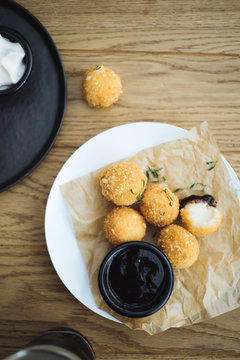 A cheese balls served with sauce
